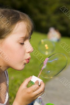 girl and a soap bubble