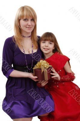 Mother and daughter with gift.