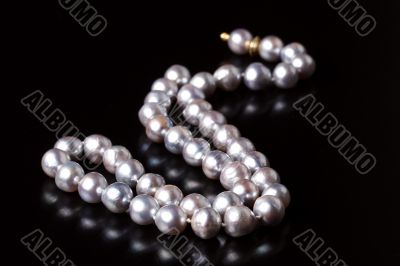 grey pearls on black