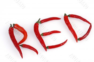 red hot chilis arranged to spell RED