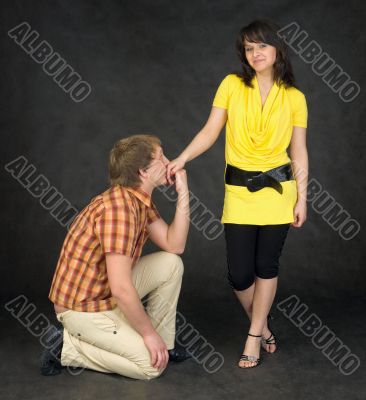 Guy kissing female hand