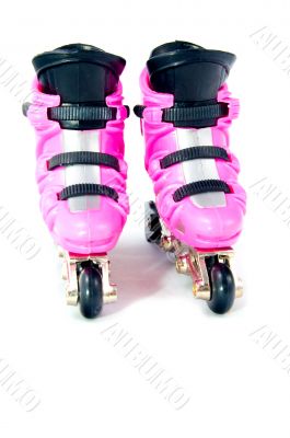 font view of two pink rollerscates isolated on a white backgroun