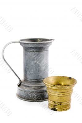 old tin watercan and a bronze bucket on white