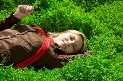 Lying in green grass