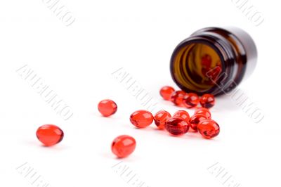 bottle with red pills