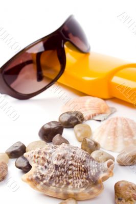 shells, sunglasses and lotion