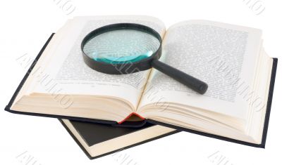 Open book and magnifier