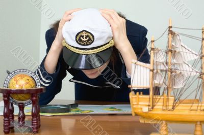 Girl - the sea captain with a card