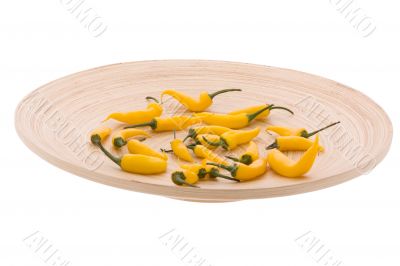 Yellow chilli in the wood plate
