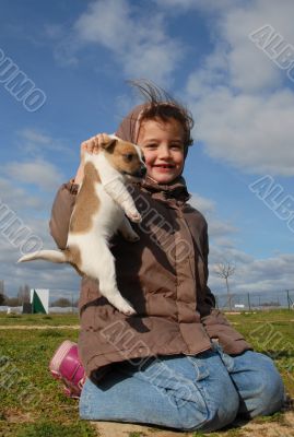 little girl and her puppy