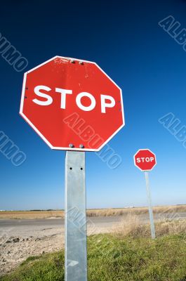 couple of stop traffic signs