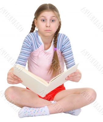 Surprised girl with the book in hands