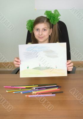 Smiling girl shows new drawing to us