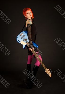 Rock girl with bass guitar