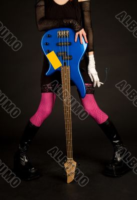Close-up of girl with bass guitar and cigarette