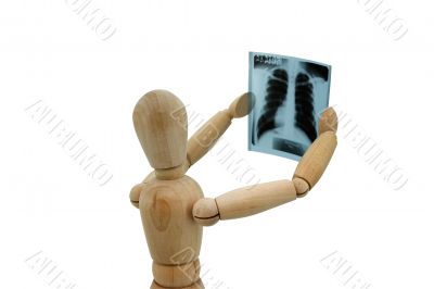 Wooden man looking at x-ray image