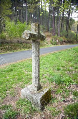 cross next to road