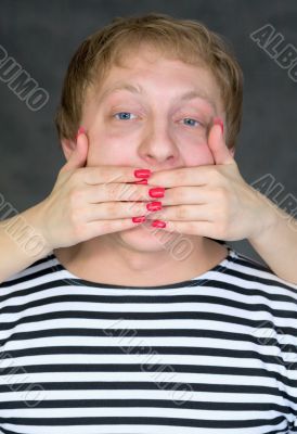 Hands have covered a man`s mouth