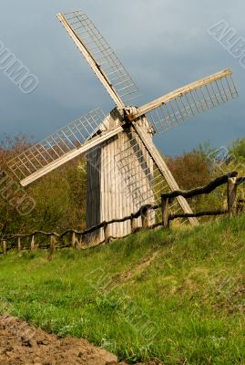 Old windmill and wooden fence