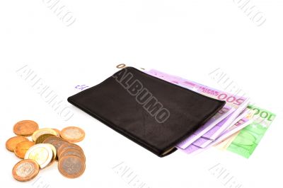 euro`s banknotes in black purse and coins