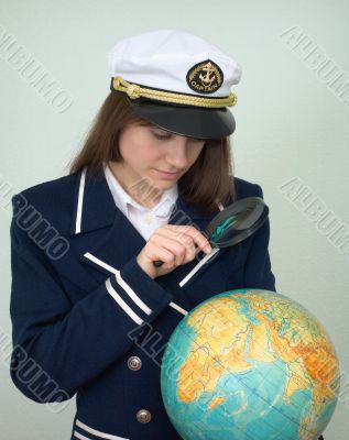Girl - the captain examines the globe