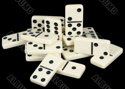 Small group from dominoes counters on a black