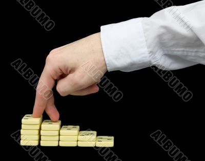 Ascension on a pedestal from dominoes