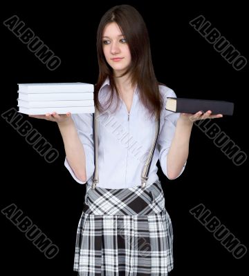 Girl with books on hands on a black