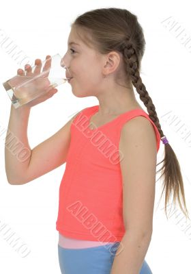 Girl drinks water from a glass