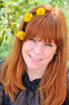Beauty Redheaded Girl With Dandelions In Her Hair