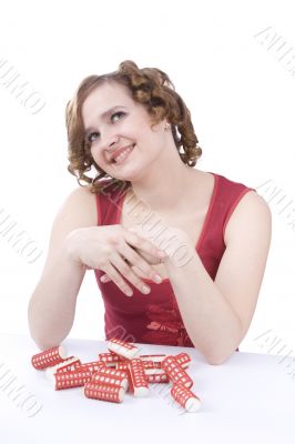Young woman with hair-curlers.