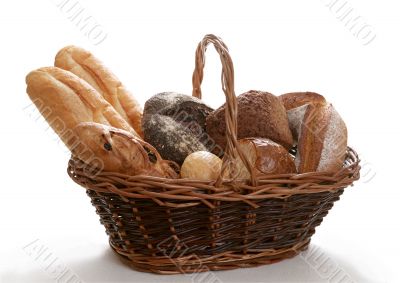 basket assortment of baked bread isolated on white