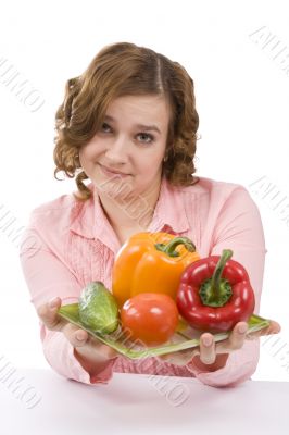 Beautiful young woman with fresh vegetables.