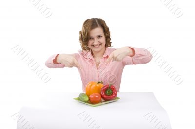 Beautiful young woman with fresh vegetables.