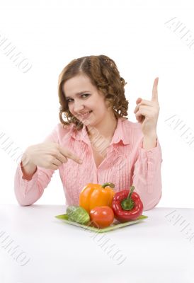 Pretty girl with fresh vegetables.