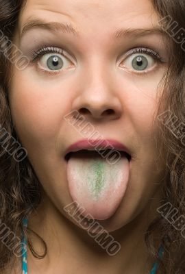 funny woman with green tongue