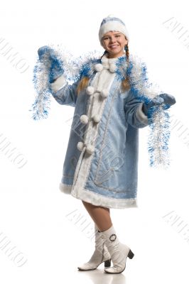 Happy girl in snow maiden coat with tinsel