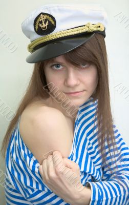 Woman in a stripped vest shows a tattoo
