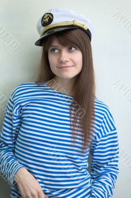 girl in stripped vest and a uniform cap