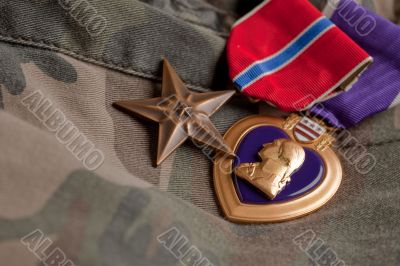 Bronze and Purple Heart Medals on Camouflage Material