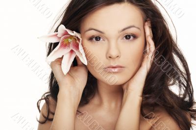 Beautiful portrait of a  sexy woman with bright white flowers.