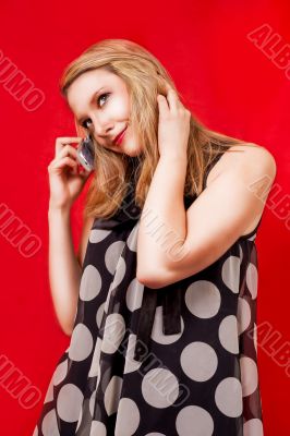 smiling blonde speaking on phone isolated