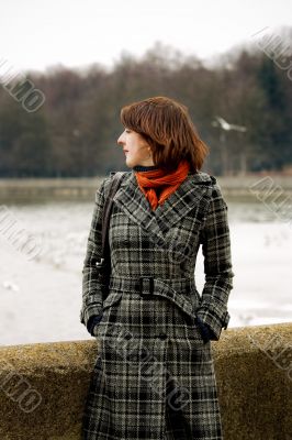 young woman near river standing