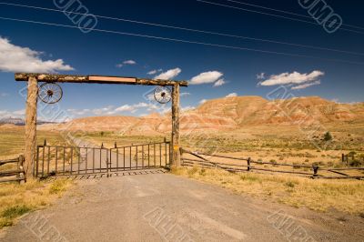 A gate and a fence in desert, wild west