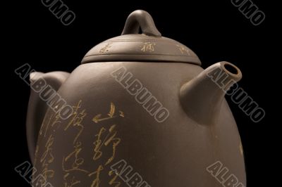 teapot on black background