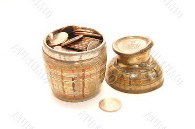 Old bowl filled with coins