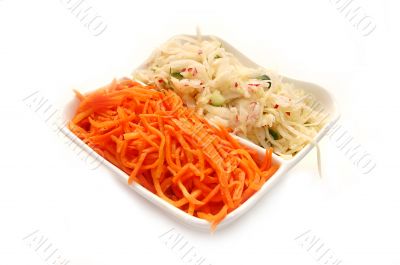 Plate with salads from cabbage and carrots