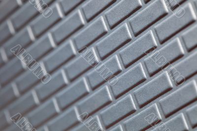Wall of metallic bricks