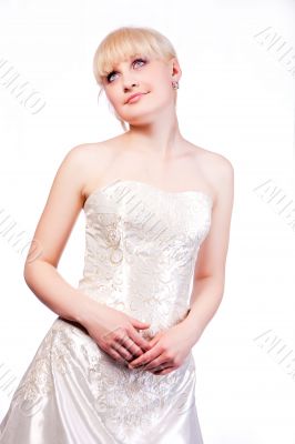 blonde in white wedding dress with hands crossed
