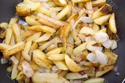 fried potatoes in griddle macro